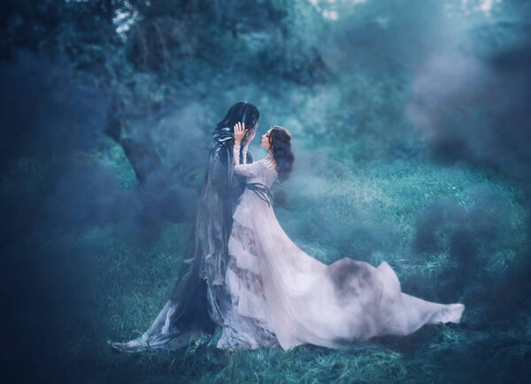 Brunette girl ghost and spirit of nightly mysterious cold blue forest, lady in white vintage lace dress with long flying train hugs dark terrible death god, lost sinful soul in thick fog, black smoke.