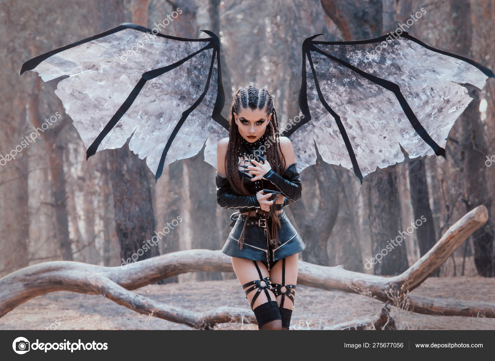 Female Demon With And Dark Makeup Girl With Big Wings In Black Short