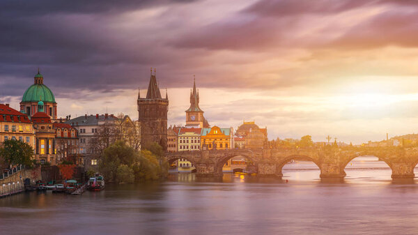 Scenic spring sunset aerial view of the Old Town pier architecture and Charles Bridge over Vltava river in Prague, Czech Republic