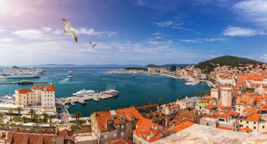 Split waterfront and Marjan hill aerial view, Dalmatia, Croatia. Panoramic summer cityscape of old medieval city Split, Croatia, Europe.  Traveling concept background. Seagull's flying over Split. clipart