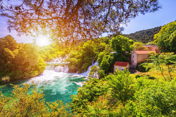 Waterfalls Krka, National Park, Dalmatia, Croatia. View of Krka National Park, Roski Slap location, Croatia, Europe. Beautiful world of Mediterranean countries. Traveling concept background.