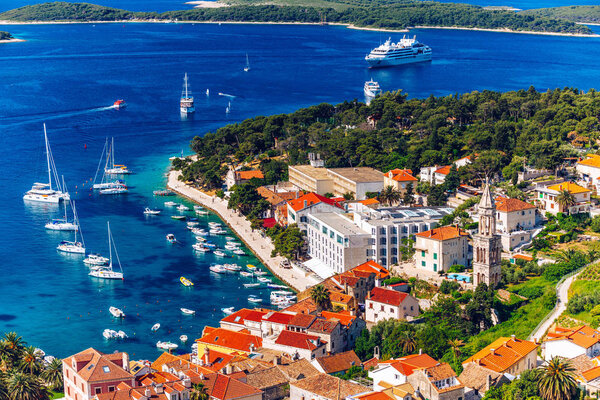 View at amazing archipelago with boats in front of town Hvar, Croatia. Harbor of old Adriatic island town Hvar. Popular touristic destination of Croatia. Amazing Hvar city on Hvar island, Croatia. 