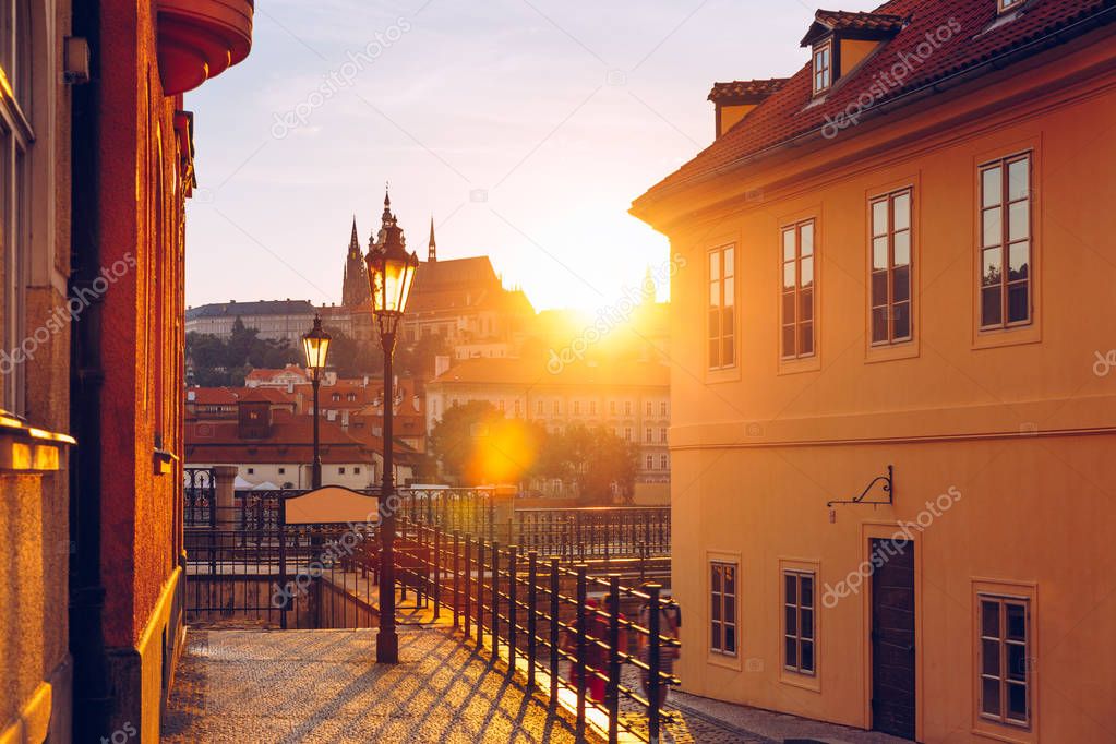 Beautiful view of Prague Castle at sunset from a historical stre