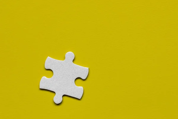 Closeup of jigsaw puzzle isolated. Missing jigsaw puzzle piece,