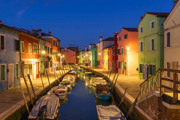 Street view with colorful buildings in Burano island, Venice, It
