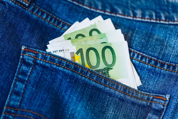 Euro bills in jeans pocket background. Euro banknotes in jeans b
