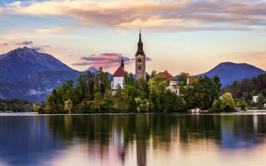 Lake Bled with St. Marys Church of Assumption on small island. B clipart