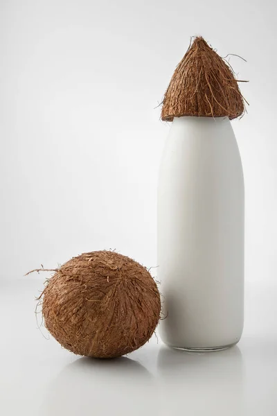 Coconut milk in a glass bottle, natural coconut.