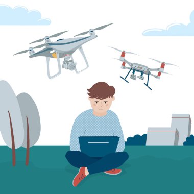 Çocuk dizüstü bilgisayarlarıyla kuadkopter drone kullanıyor.