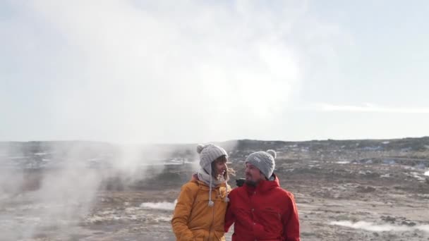 Travel couple on the background of geysers — Stock Video