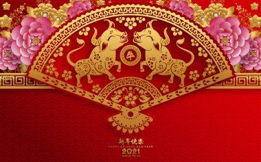 2021 yılında Çin 'de öküz, kırmızı kağıt arka planda el işi tarzıyla öküz, çiçek ve Asyalı elementleri kesiyor. (Çince çevirisi: Mutlu Çince yeni yıl 2021, öküz yılı)