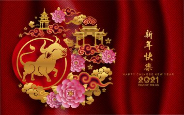 2021 yılında Çin 'de öküz, kırmızı kağıt arka planda el işi tarzıyla öküz, çiçek ve Asyalı elementleri kesiyor. (Çince çevirisi: Mutlu Çince yeni yıl 2021, öküz yılı)
