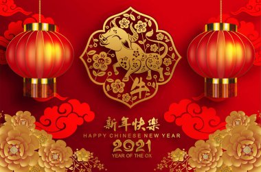 2021 yılında Çin 'de öküz, kırmızı kağıt arka planda el işi tarzıyla öküz, çiçek ve Asyalı elementleri kesiyor. (Çince çevirisi: Mutlu Çince yeni yıl 2021, öküz yılı)