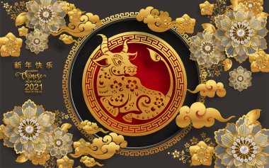 2021 yılında Çin 'de öküz, kırmızı kağıt arka planda el işi tarzıyla öküz, çiçek ve Asyalı elementleri kesiyor. (Çince çevirisi: Mutlu Çince yeni yıl 2021, öküz yılı)