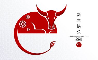 2021 yılında Çin 'de öküz, kırmızı kağıt arka planda el işi tarzıyla öküz, çiçek ve Asyalı elementleri kesiyor. (Çince çevirisi: Mutlu Çince yeni yıl 2021, öküz yılı)