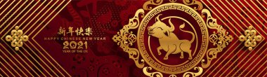 2021 yılında Çin 'de öküz, kırmızı kağıt arka planda el işi tarzıyla öküz, çiçek ve Asyalı elementleri kesiyor. (Çince çevirisi: Mutlu Çince yeni yıl 2021, öküz yılı)