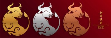 2021 yılında Çin 'de öküz, kırmızı kağıt arka planda el işi tarzıyla öküz, çiçek ve Asyalı elementleri kesiyor. (Çince çevirisi: Mutlu Çince yeni yıl 2021, öküz yılı)