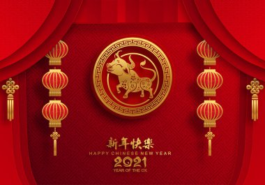 2021 yılında Çin 'de öküz, kırmızı kağıt arka planda el işi tarzıyla öküz, çiçek ve Asyalı elementleri kesiyor. (Çince çevirisi: Mutlu Çince yeni yıl 2021, öküz yılı)