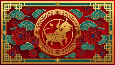 2021 yılında Çin 'de öküz, kırmızı kağıt arka planda el işi tarzıyla öküz, çiçek ve Asyalı elementleri kesiyor. (Çince çevirisi: Mutlu Çince yeni yıl 2021, öküz yılı)