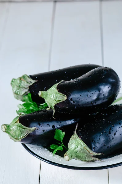 Eggplants Wooden Table Fresh Herbs Selective Focus — Stock Photo, Image
