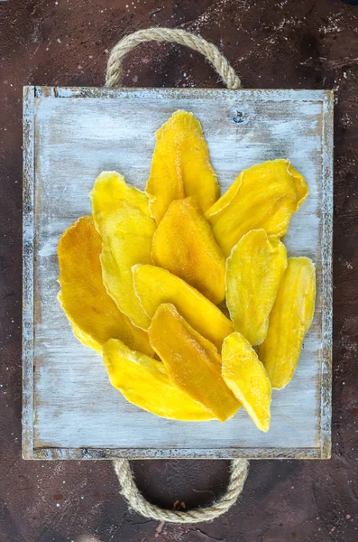 Dried Mangos on a wooden tray