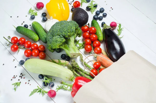 Paper bag of different health food on a white background. Flat l — Stock Photo, Image