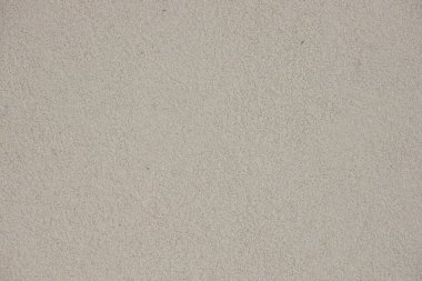 Dekoratif ayrıştırma malzemelerinin oluşturduğu beyaz taneli duvar, yakın plan. Mimari ön cephe tasarımı.