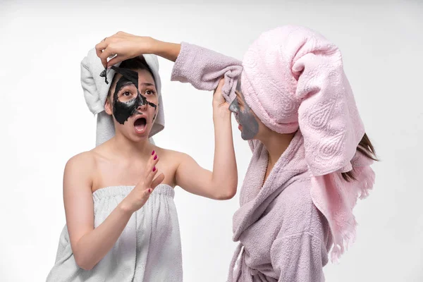 Lesbians help each other to remove face masks from the face to heal the skin. Have a great time together and show feelings.