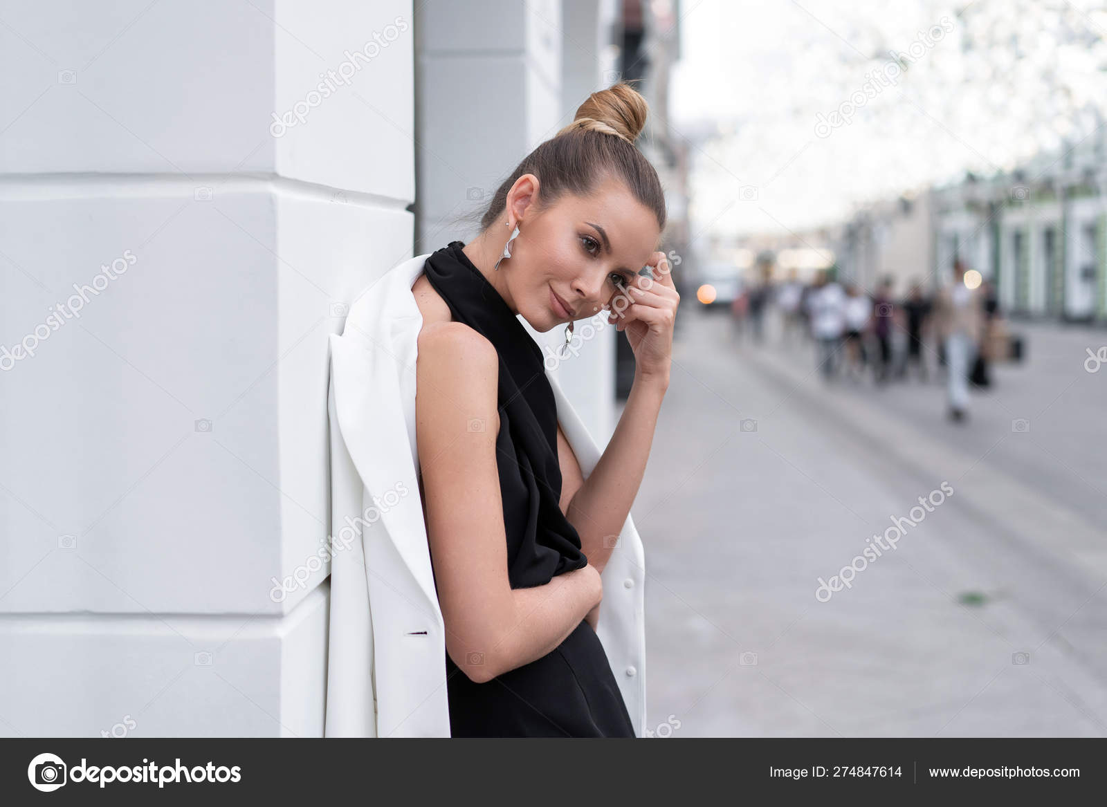 Model Girl European Type 30 Years Old In A Black Dress And A White
