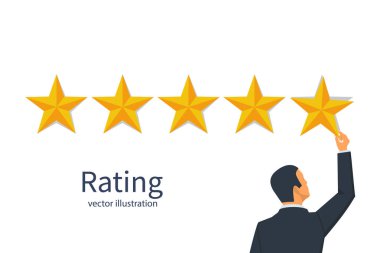 Star Rating. Altın yıldız elinde tutan işadamı