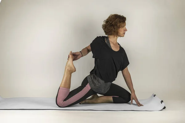 Woman portrait breathing while doing yoga exercises. Balance pra