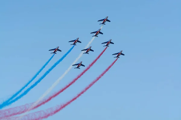 Toulon, FRANCE - August 15, 2018: Patrouille de France aerobatics team, famous demonstration of French Air force, Alpha jets of Patrouille de France in full formation.