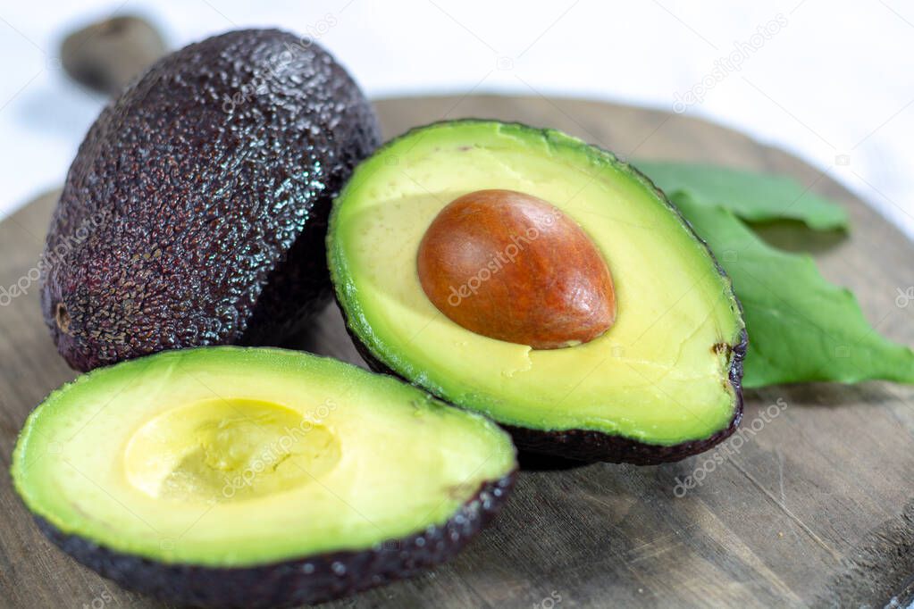 Two fresh ripe raw hass avocados, close up, healthy food concept