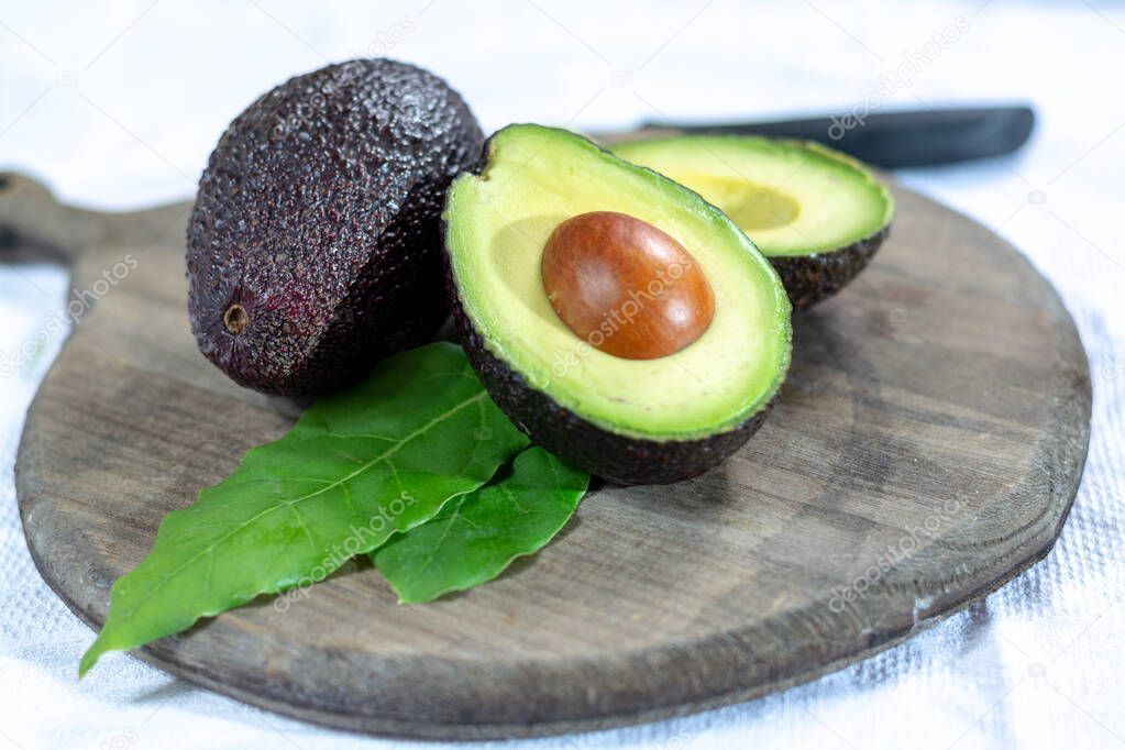 Two fresh ripe raw hass avocados, close up, healthy food concept
