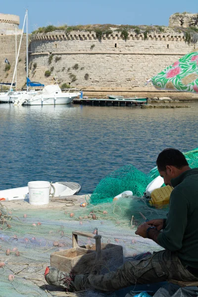 Morning landscape photo made in Gallipoli pier, fishermen reparing his fishermen net after fishing, Apulia, Italy — Stock Image Morning Landscape Photo Made Gallipoli Pier Fishermen Reparing His Fishermen Royalty Free Stock Images