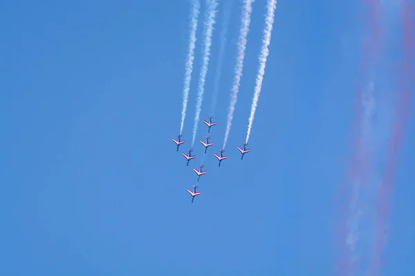 Toulon, FRANCE - August 15, 2018: Patrouille de France aerobatics team, famous demonstration of French Air force, Alpha jets of Patrouille de France in full formation.
