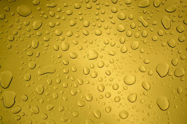 要約黄色の水や雨が透明な背景をドロップ 壁紙のクローズアップ — ストック写真