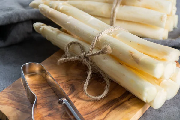 Spring season, new harvest of Dutch, German white asparagus, bunch of raw white asparagus