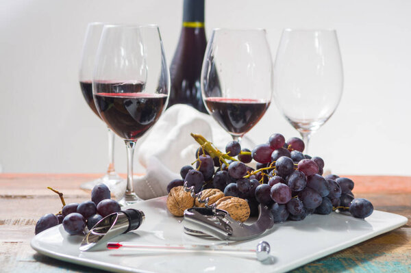 Professional red wine tasting event with high quality wine glasses and wine accessories close up