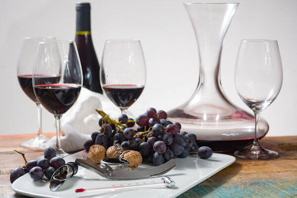 Professional red wine tasting event with high quality wine glasses and wine accessories close up