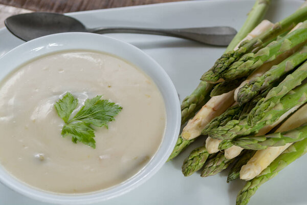 Seasonal fresh homemade asparagus soup made from white and green asparagus, healthy  vegetables
