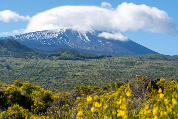 View on active stratovolcano Mount Etna on east coast of island Sicily, Italy in spring