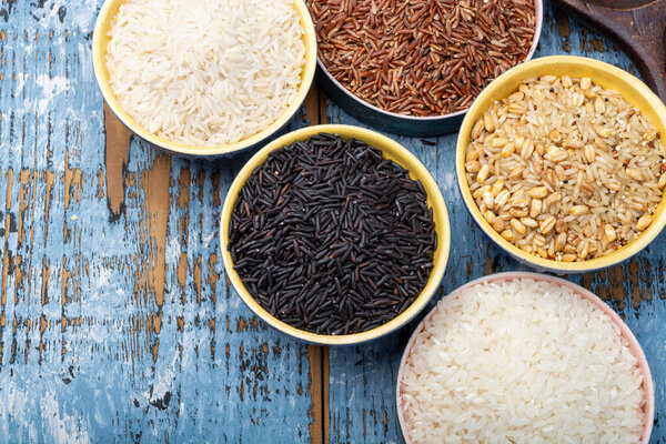 Different types of rice, white basmati, jasmine, arborio, brown and black, rice collection