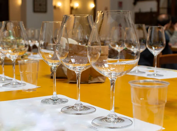 Professional wine tasting event in winery, sommelier course, clean empty wine glasses for different wines