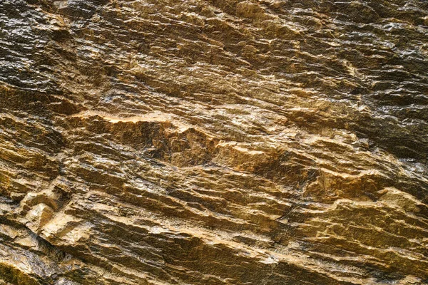 金色の鉱物岩のテクスチャを持つ抽象的な背景がコピースペースを閉じます — ストック写真