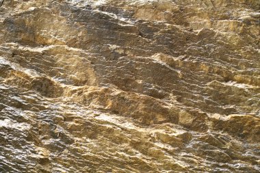 Altın rengi mineral kaya dokusuna sahip soyut arkaplan kopyalama alanını kapat