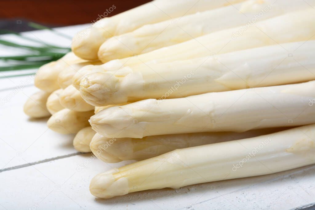 Bunch of fresh uncooked white asparagus, new harvest, close up