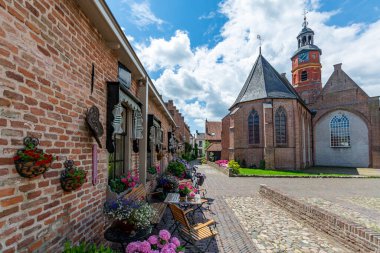 Old Dutch houses in little ancient town with big history Buren, Gelderland, Netherlands clipart
