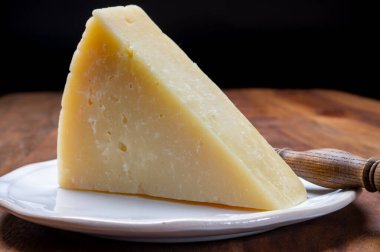 Italian cheeses collection, matured pecorino romano hard cheese made from sheep melk close up clipart