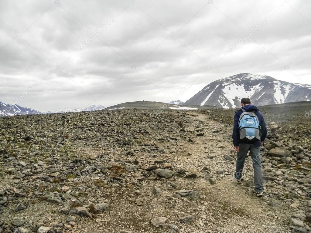 Man doing trekking on the wild Besseggen Ridge, Norway